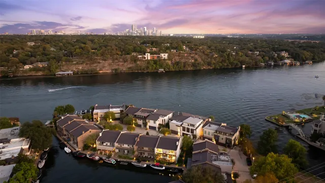 an aerial view of a house with a lake view