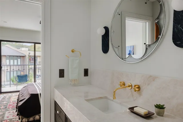 a bathroom with a sink and a mirror