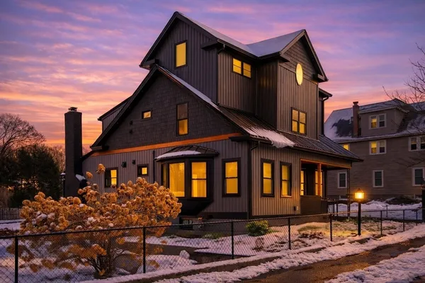 a kitchen with granite countertop a sink a stove and cabinets