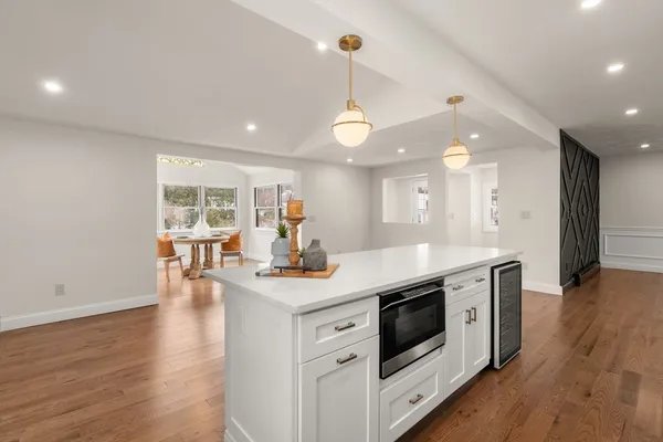 a view of a house with entryway and wooden fence