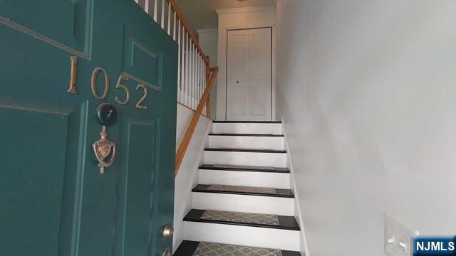 1052 Chedworth Circle Mahwah, NJ 07430 - Photo 3 of 16 a view of staircase with white walls and a window