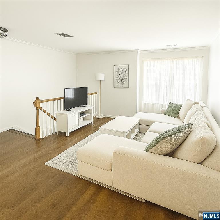 1052 Chedworth Circle Mahwah, NJ 07430 - Photo 4 of 16 a bedroom with a bed and flat screen tv