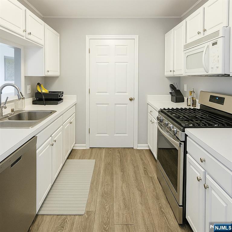 1052 Chedworth Circle Mahwah, NJ 07430 - Photo 7 of 16 a kitchen with cabinets appliances and a sink