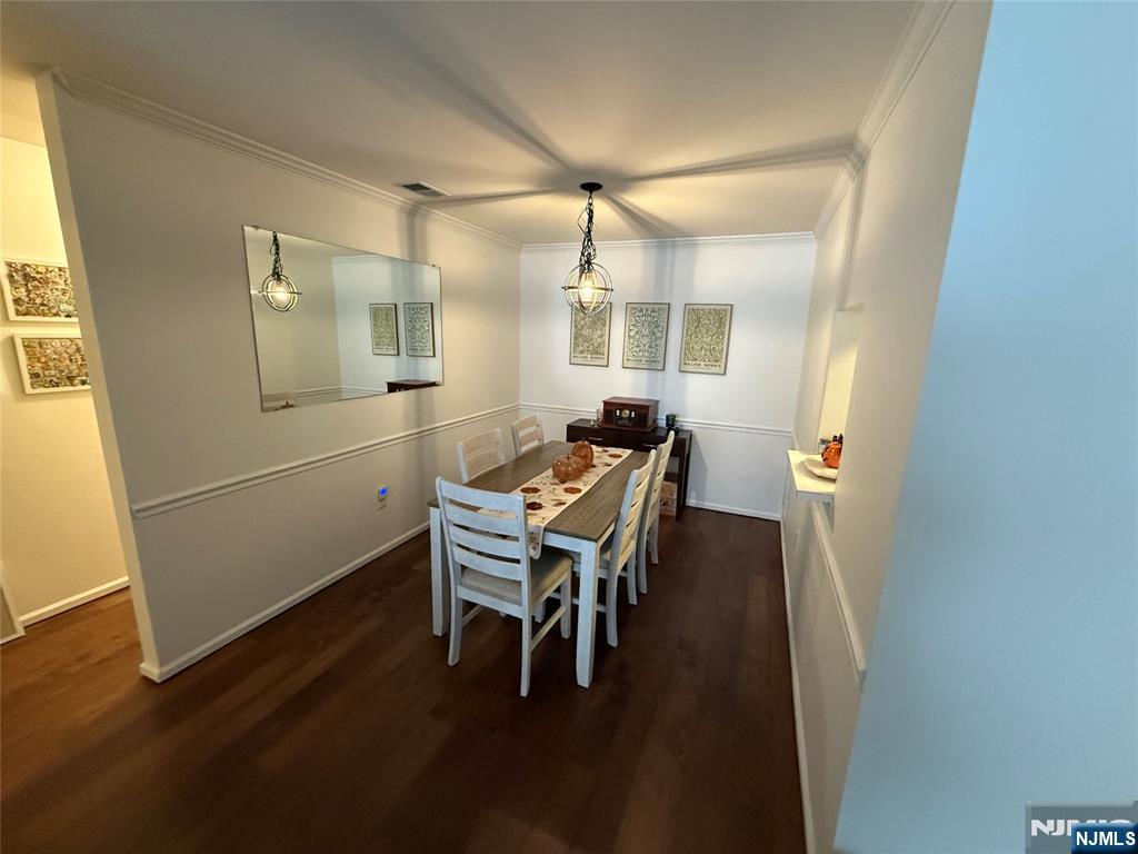 1052 Chedworth Circle Mahwah, NJ 07430 - Photo 8 of 16 a dining room with furniture and wooden floor