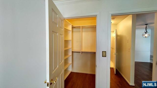 1052 Chedworth Circle Mahwah, NJ 07430 - Photo 10 of 16 a view of walk in closet with wooden floor