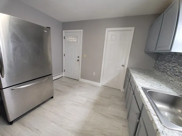 a view of kitchen and utility room