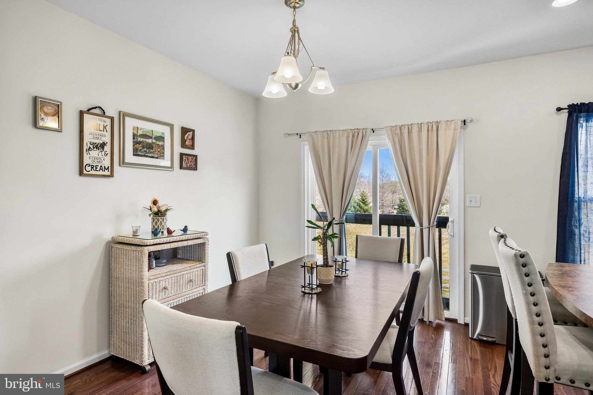 1202 Emerson Court Clementon, NJ 08021 - Photo 14 of 36 a view of a dining room with furniture window and wooden floor
