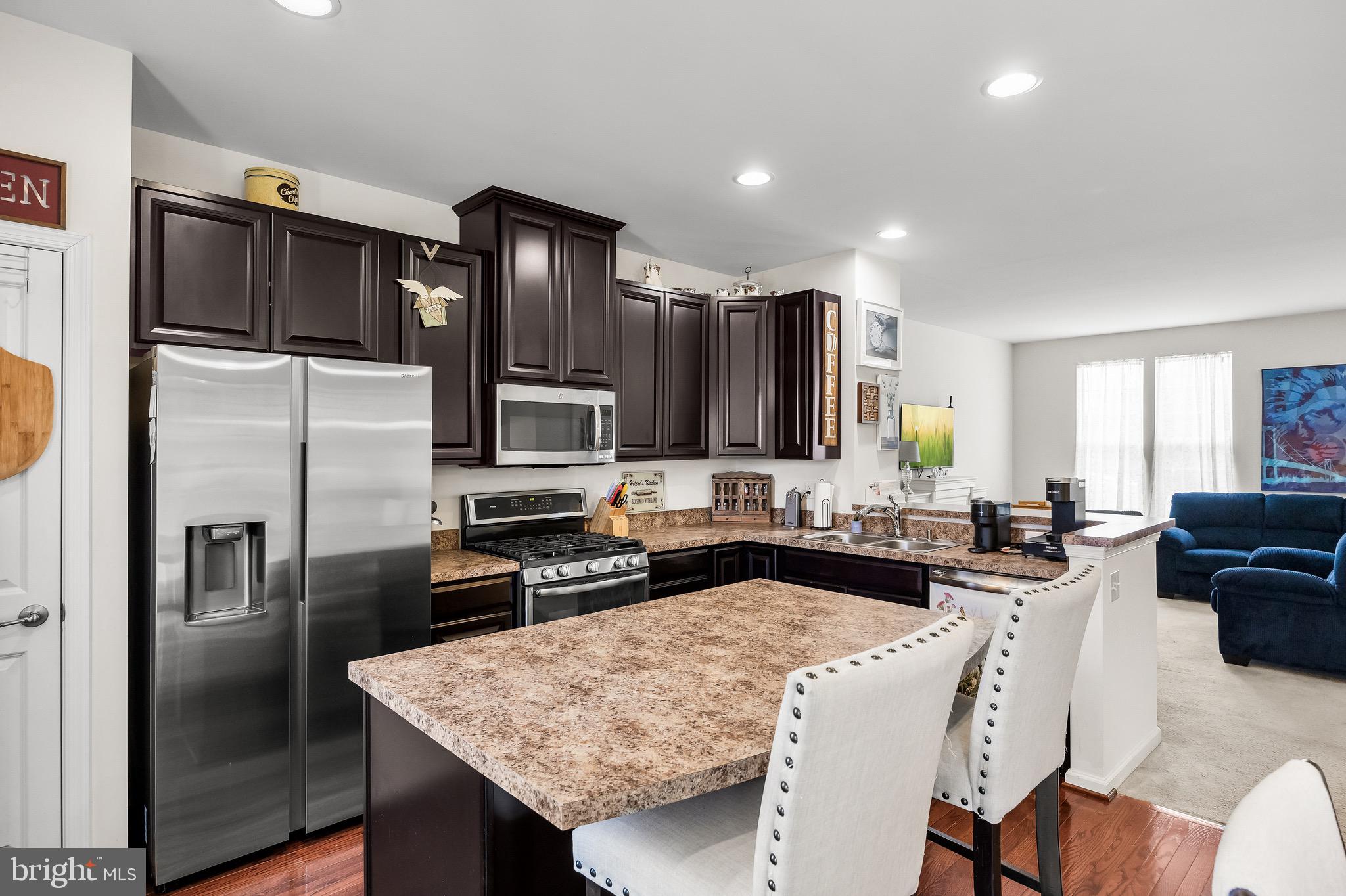 1202 Emerson Court Clementon, NJ 08021 - Photo 17 of 36 a kitchen with stainless steel appliances granite countertop a refrigerator stove microwave and sink