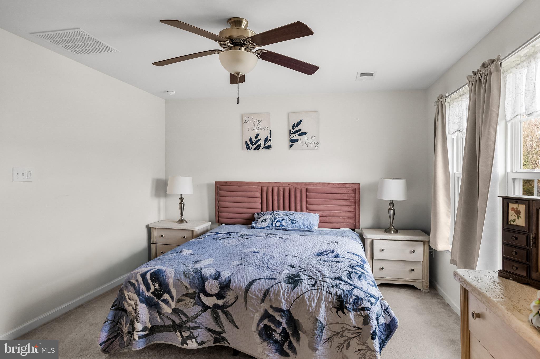 1202 Emerson Court Clementon, NJ 08021 - Photo 20 of 36 a bedroom with a bed a couch and a window