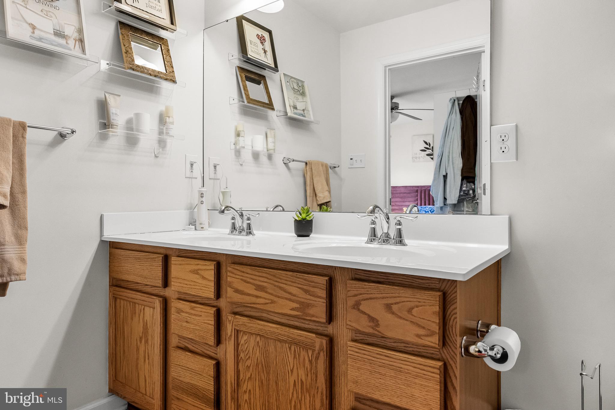 1202 Emerson Court Clementon, NJ 08021 - Photo 21 of 36 a bathroom with a sink and a mirror