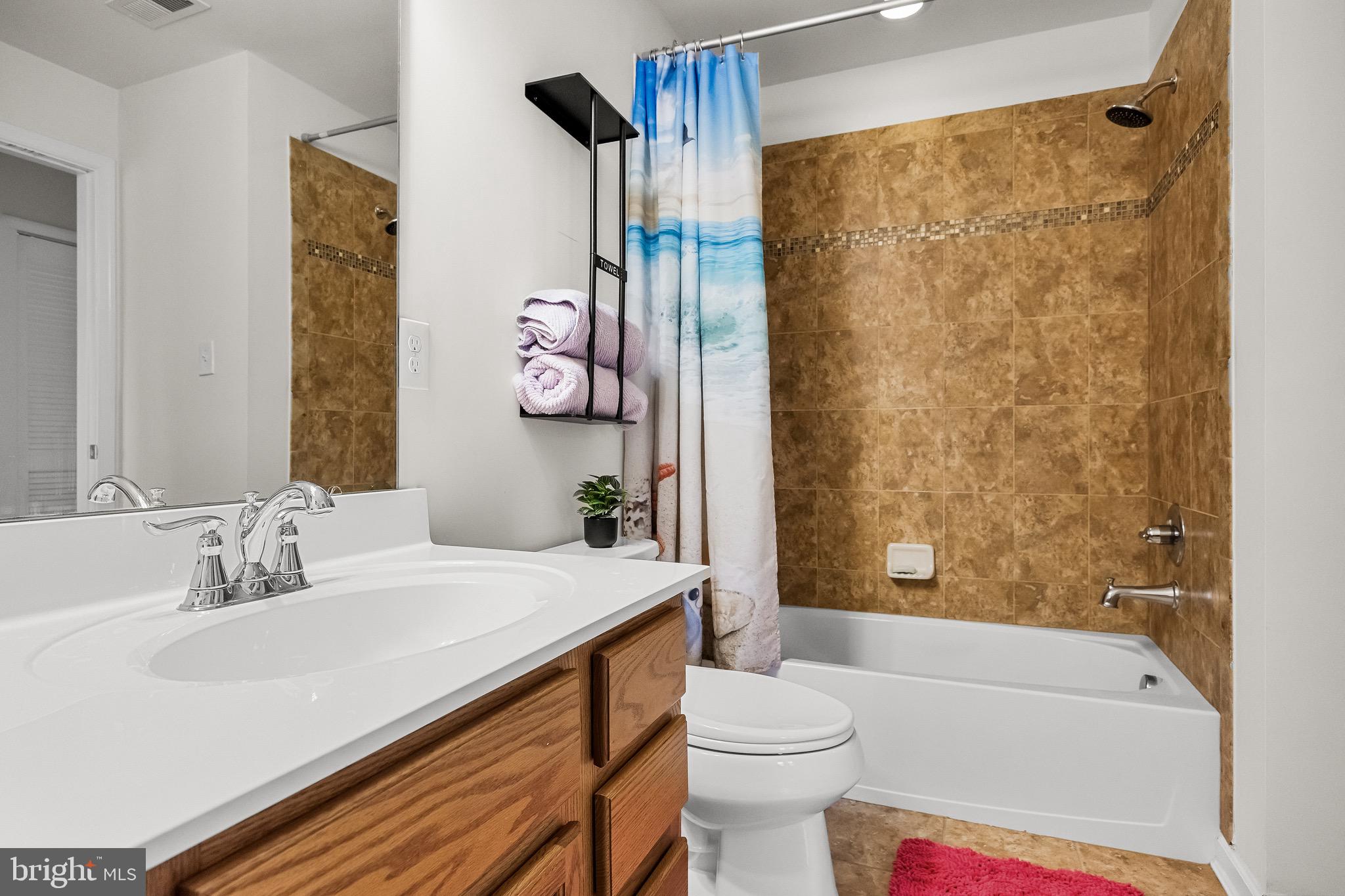 1202 Emerson Court Clementon, NJ 08021 - Photo 22 of 36 a bathroom with a sink a toilet and shower