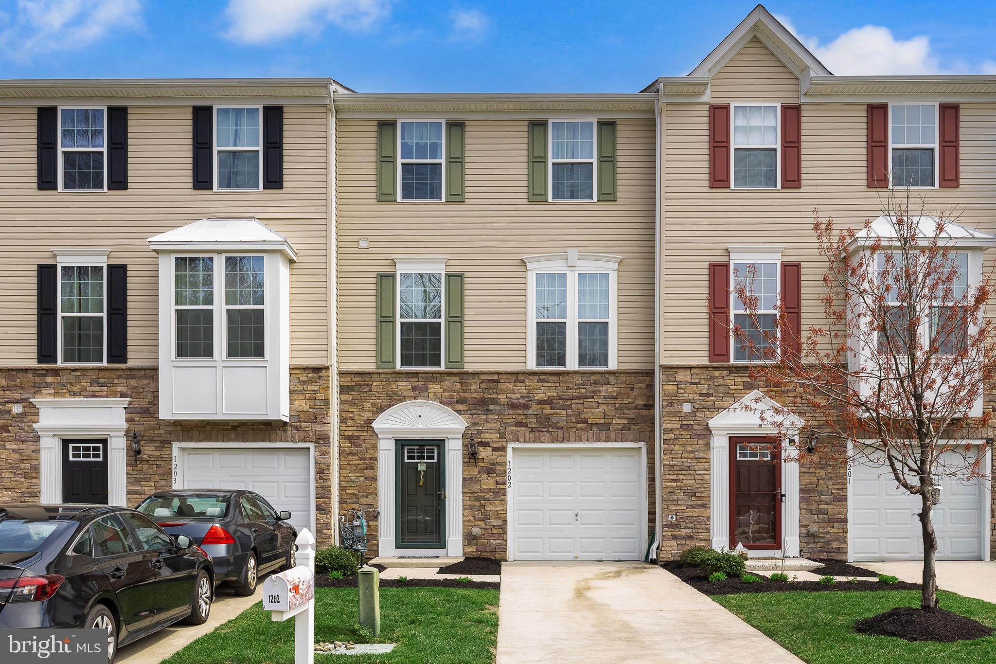 1202 Emerson Court Clementon, NJ 08021 - Photo 5 of 36 a front view of a house with garden