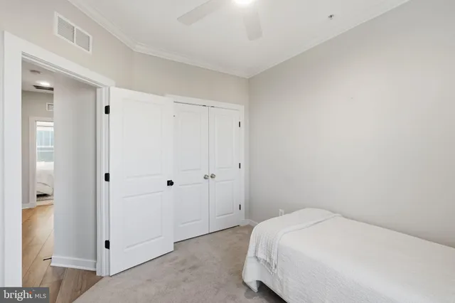 a bathroom with a sink toilet vanity and tub