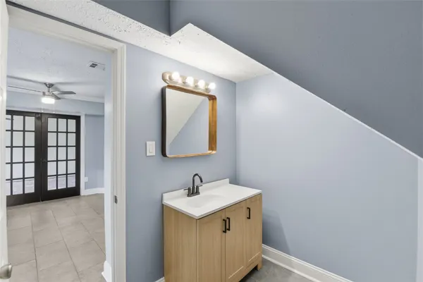 a bathroom with a sink and a mirror