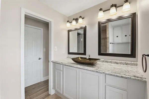 a view of an entryway with wooden floor