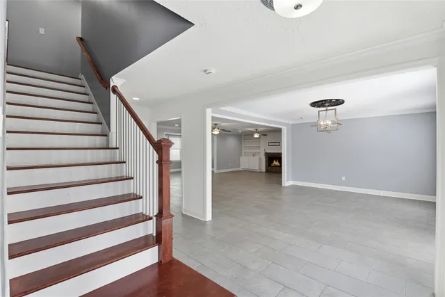 a view of a hallway with stairs