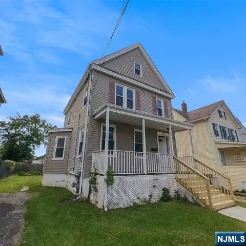 167 James Street Hackensack, NJ 07601 - Photo 3 of 30 a front view of a house with a yard