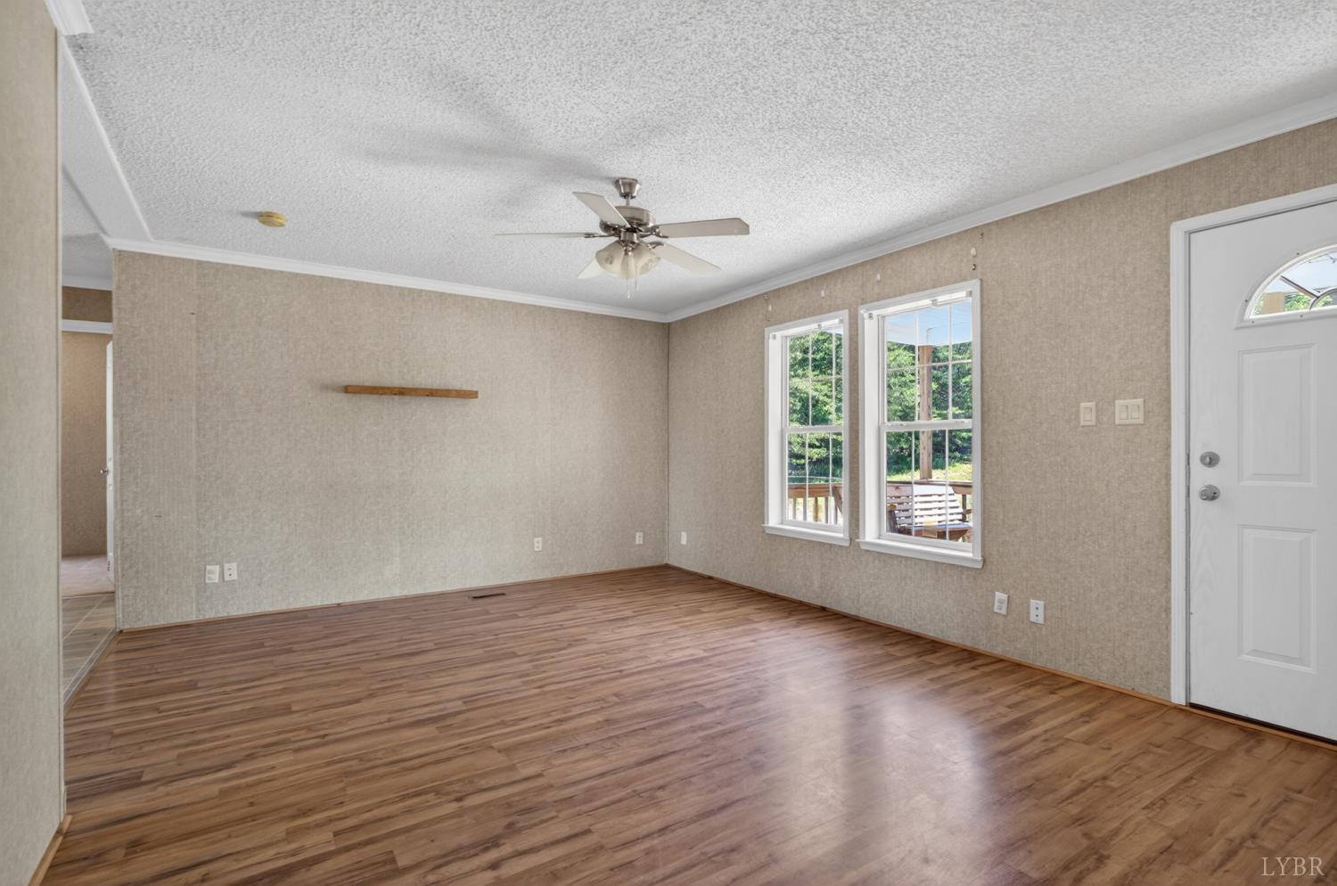 1811 Mohawk Road Gladys, VA 24554 - Photo 5 of 51 a view of an empty room with wooden floor and a window