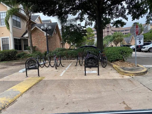 a view of backyard with swimming pool and furniture