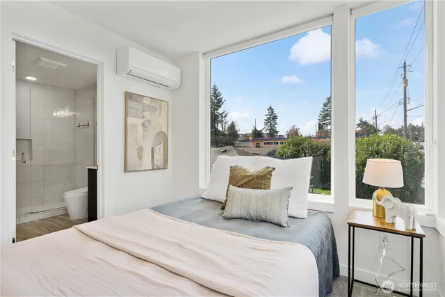 a bedroom with a bed and window