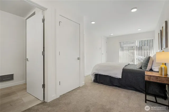 a bedroom with furniture and a window