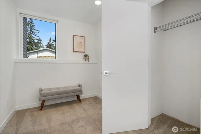 a view of room with window and furniture