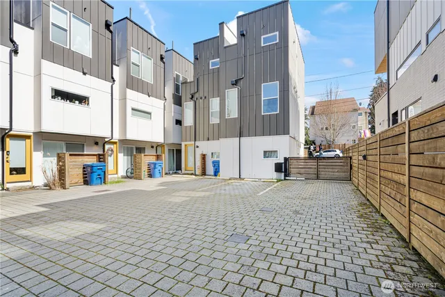 a view of a building with cars