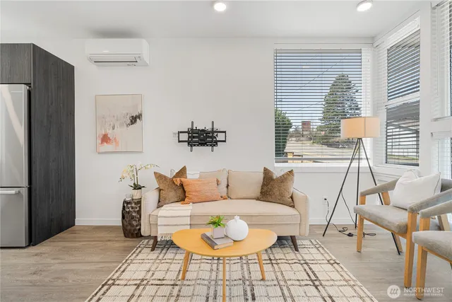 a living room with furniture and a large window