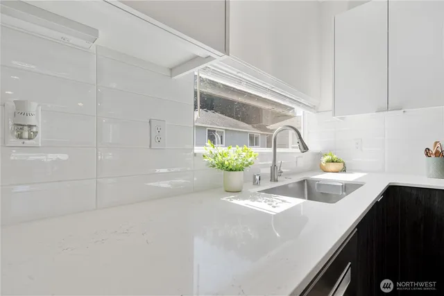 a bathroom with a sink and a shower