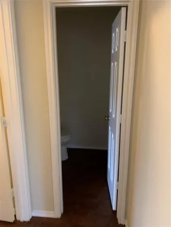 a view of front door with a hallway