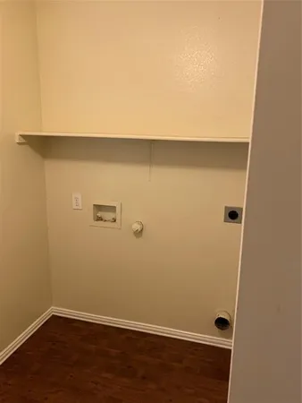 an empty room with wooden floor