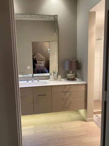 a view of a house with a swimming pool and sitting area