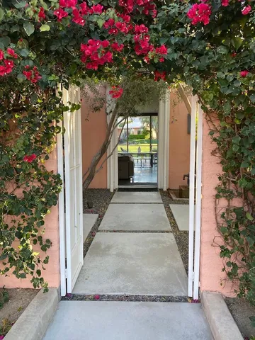 a view of a house with a flower garden