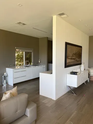 a living room with couches and a flat screen tv