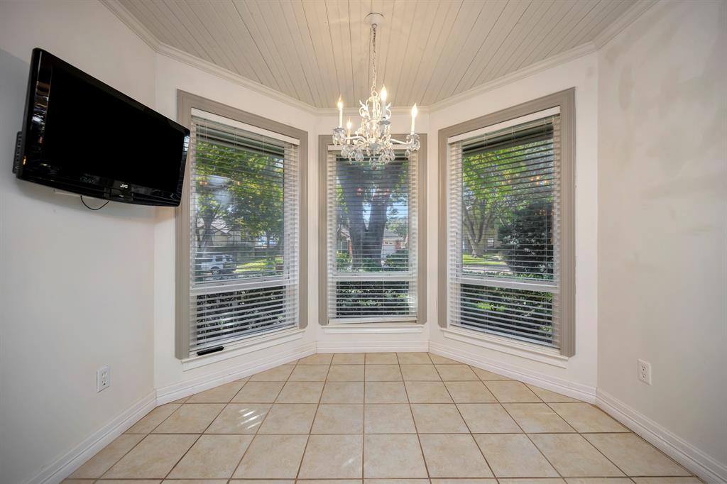 3409 Crescent Court Bedford, TX 76021 - Photo 14 of 40 a view of an empty room with wooden floor and a window