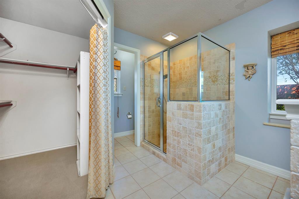 3409 Crescent Court Bedford, TX 76021 - Photo 21 of 40 a bathroom with a shower and a sink