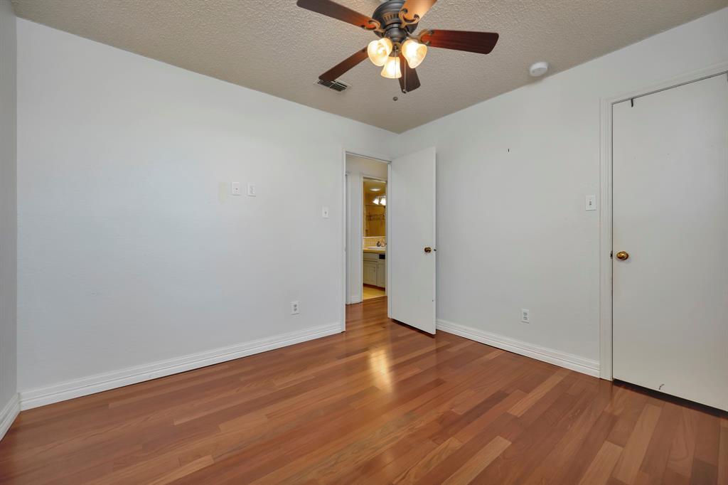 3409 Crescent Court Bedford, TX 76021 - Photo 26 of 40 a view of an empty room with wooden floor