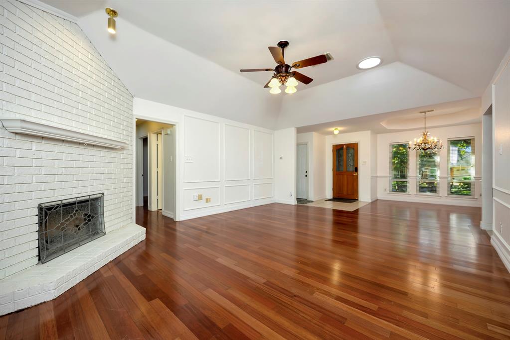 3409 Crescent Court Bedford, TX 76021 - Photo 6 of 40 a view of an empty room with wooden floor and a window