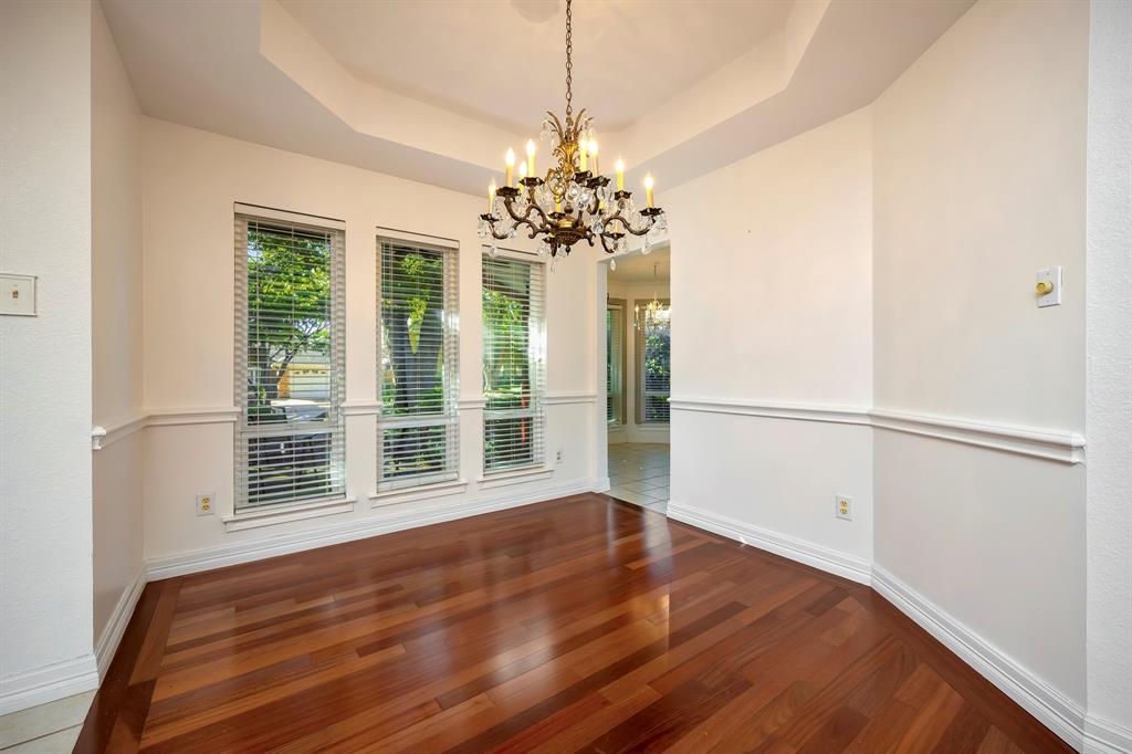 3409 Crescent Court Bedford, TX 76021 - Photo 10 of 40 a view of a room with wooden floor and chandelier