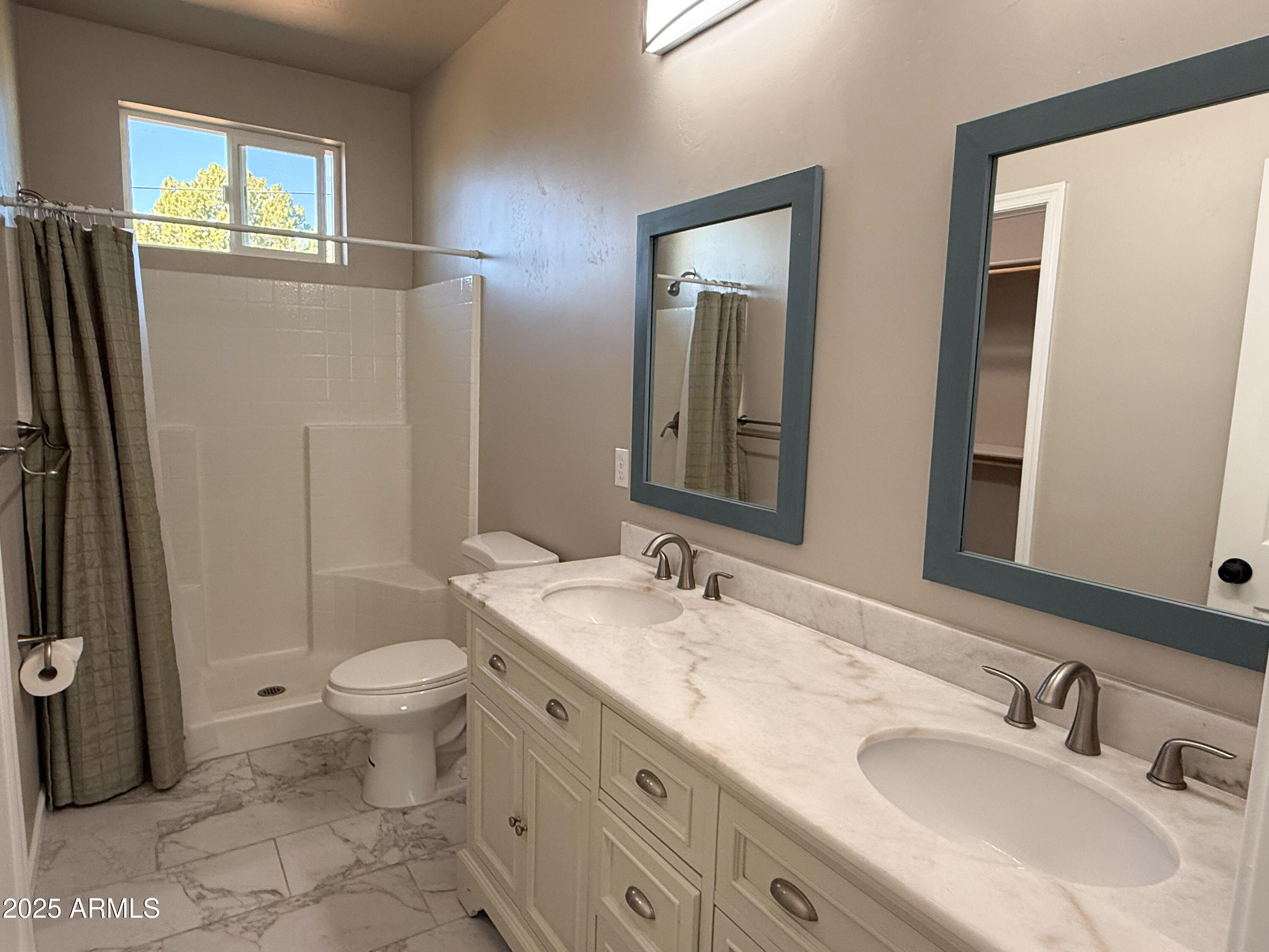 4850 East Oswego Street Rimrock, AZ 86335 - Photo 12 of 21 a bathroom with a granite countertop sink toilet and shower