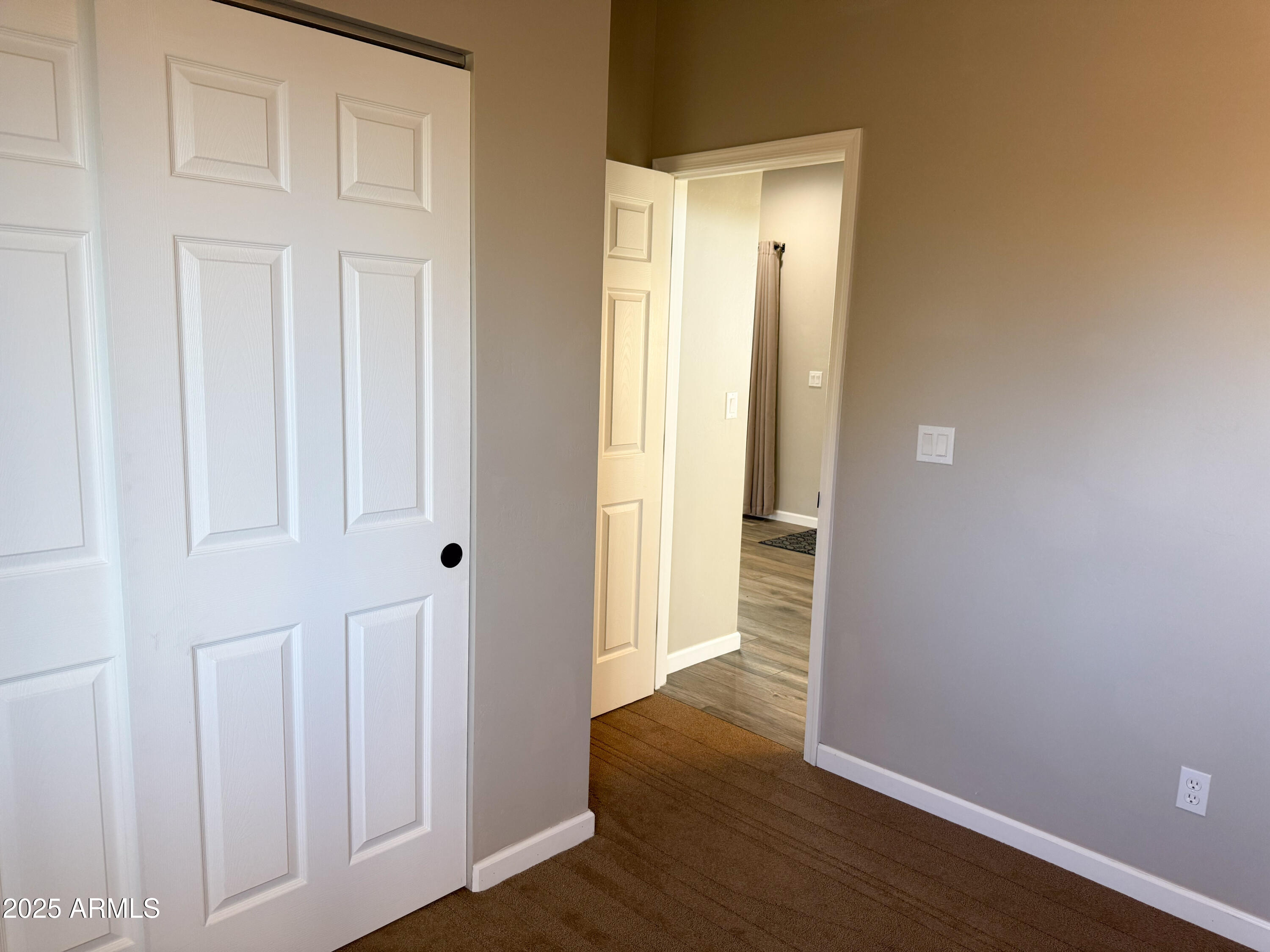 4850 East Oswego Street Rimrock, AZ 86335 - Photo 16 of 21 a view of a hallway with wooden floor