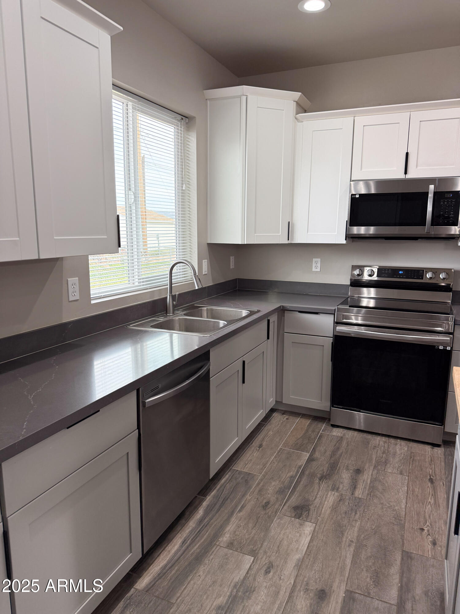 4850 East Oswego Street Rimrock, AZ 86335 - Photo 5 of 21 a kitchen with stainless steel appliances granite countertop a sink stove and cabinets