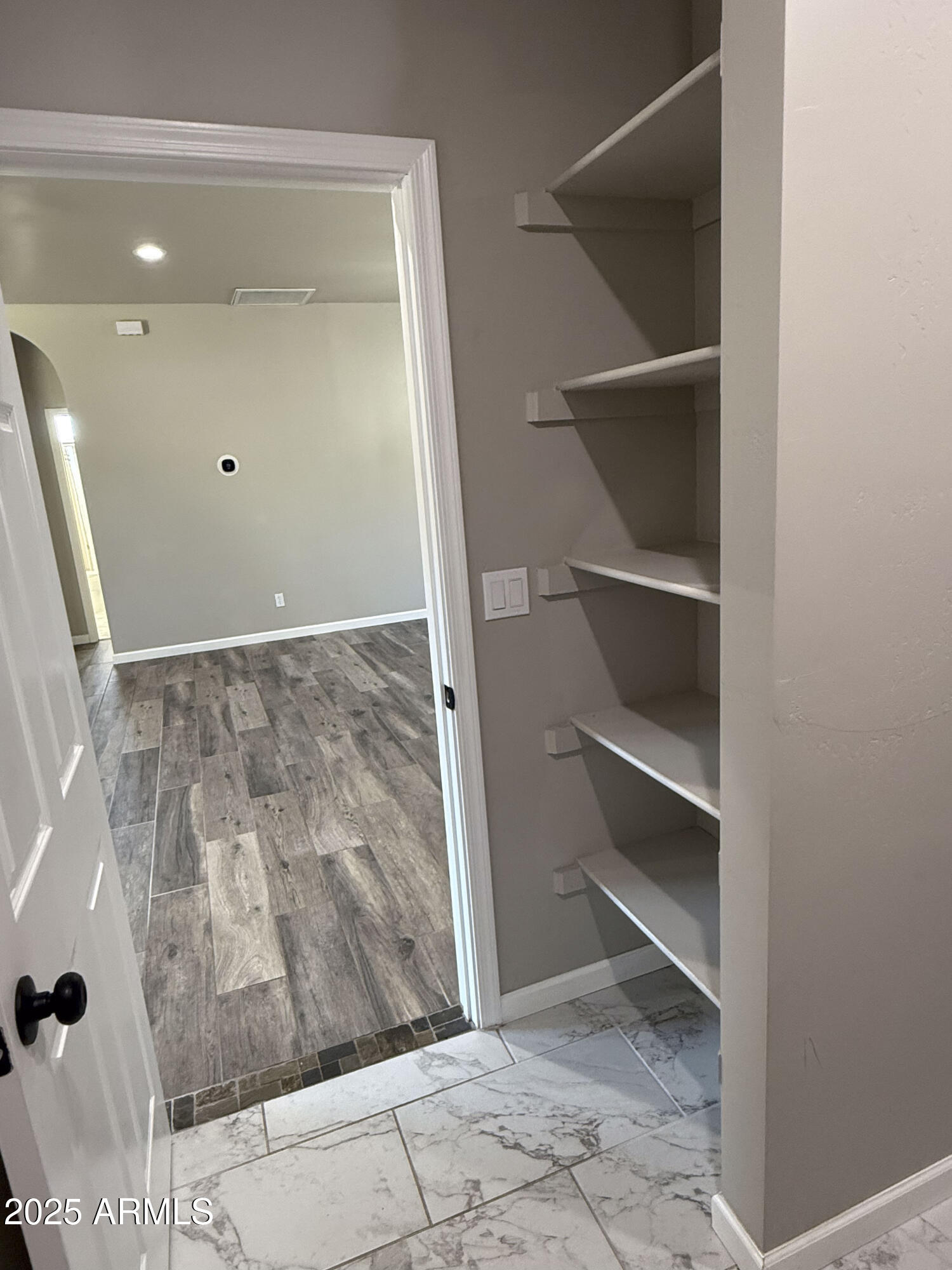 4850 East Oswego Street Rimrock, AZ 86335 - Photo 8 of 21 a view of walk in closet with empty racks
