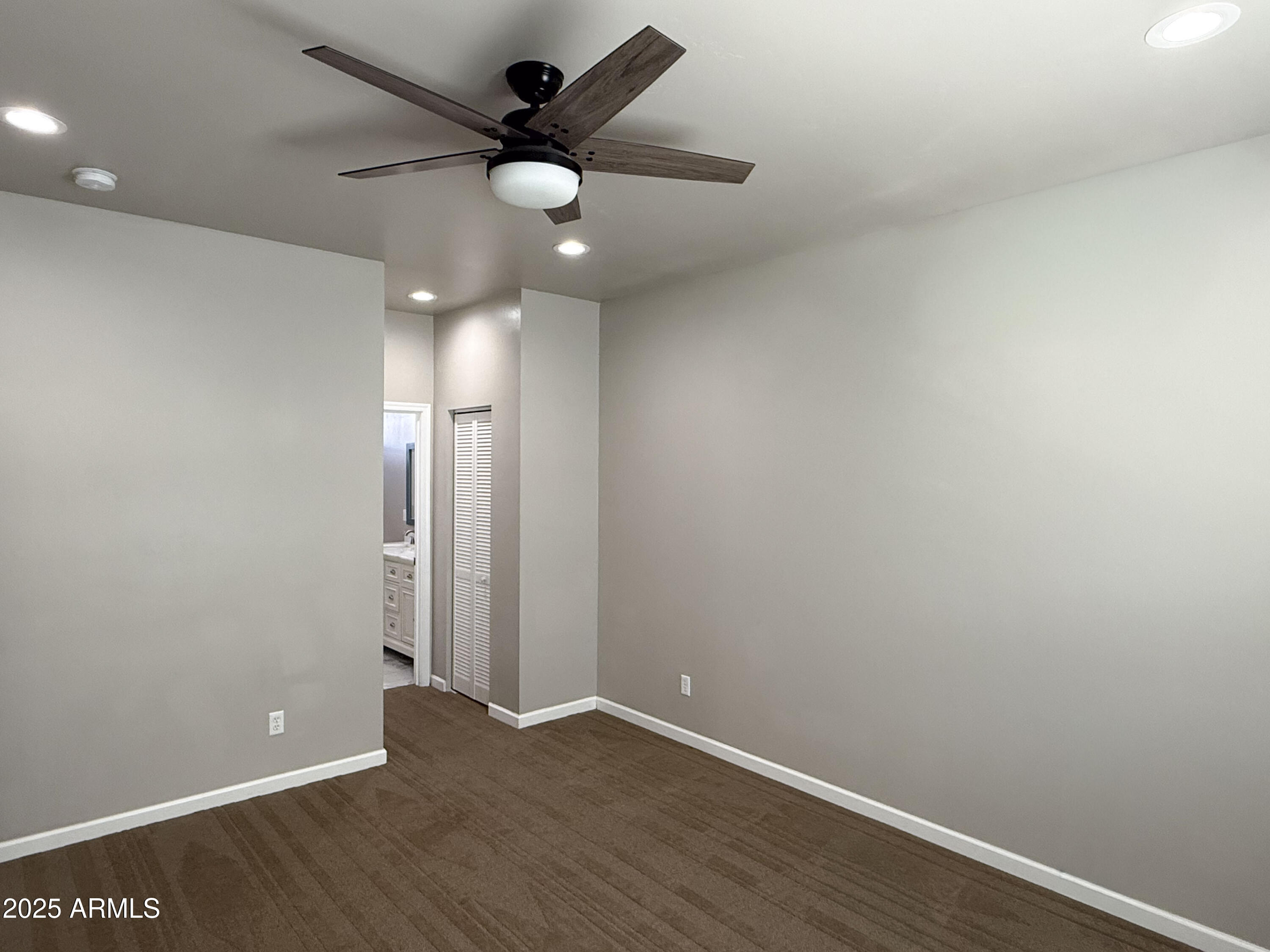 4850 East Oswego Street Rimrock, AZ 86335 - Photo 10 of 21 an empty room with a fan & a ceiling fan