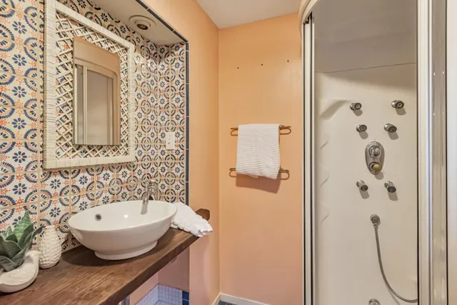 a bathroom with a sink and a mirror