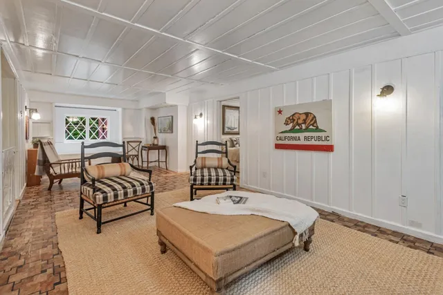 a view of a livingroom with furniture and window