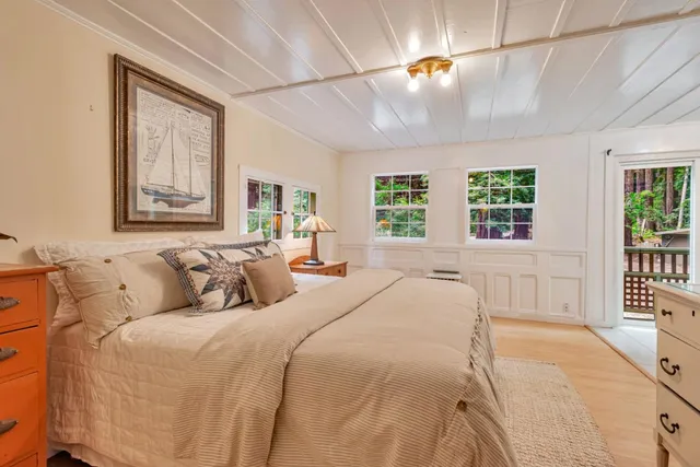 a spacious bedroom with a bed and a table