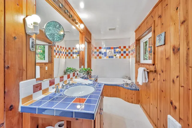 a bedroom with a large bed and a table