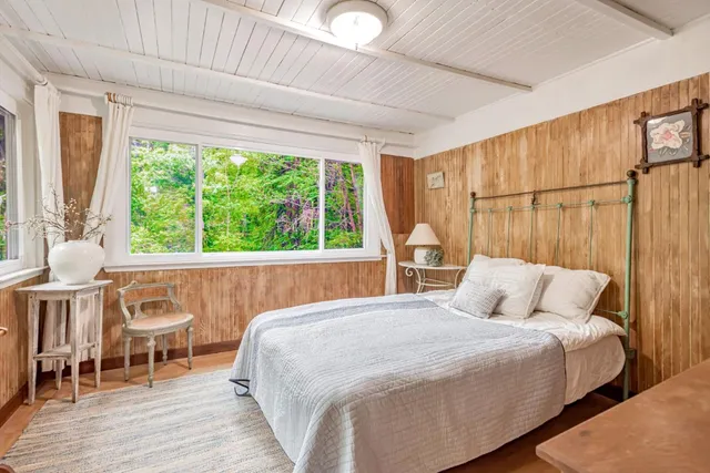a view of a room with wooden floor and walls