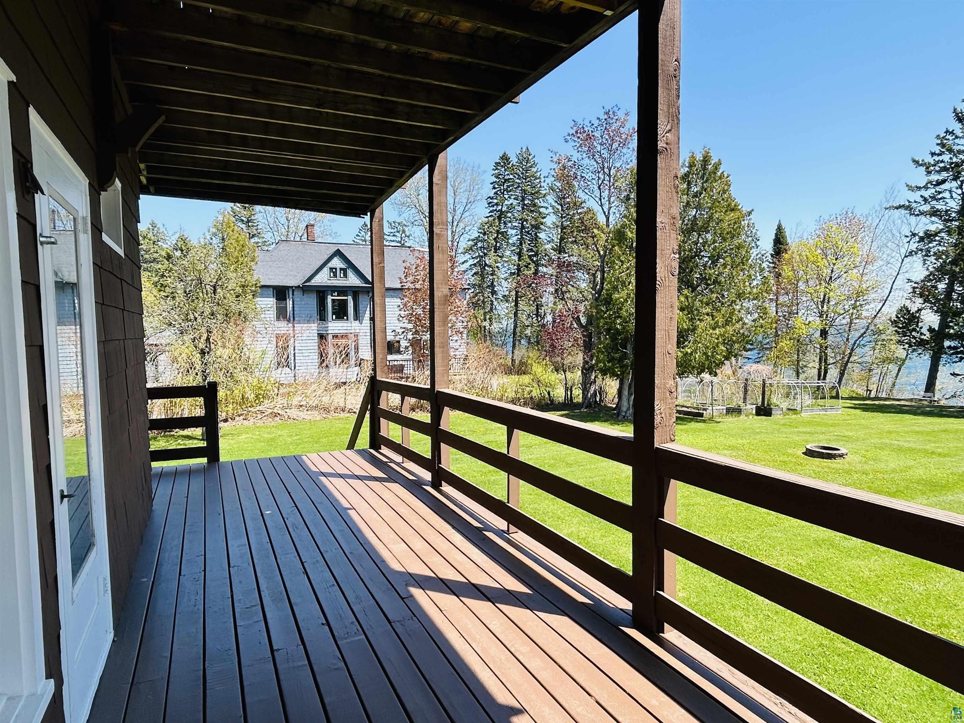 5090 London Road, Unit 1 Duluth, MN 55804 - Photo 37 of 54 Expansive covered porch featuring wood-finish decking and railing
